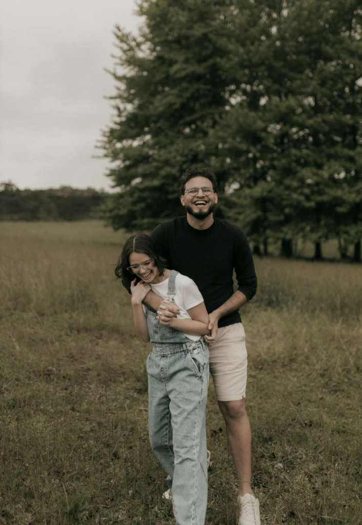 two adults hugging playfully
