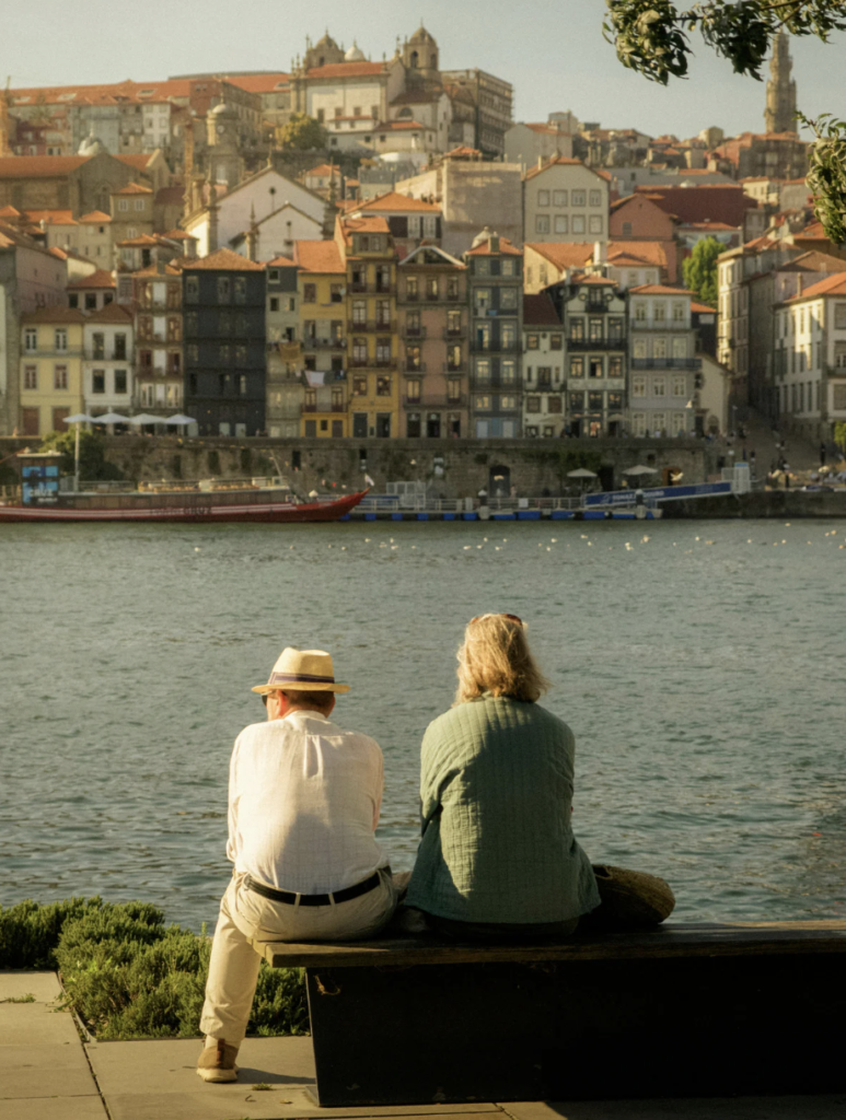 Couple sitting on the shore together