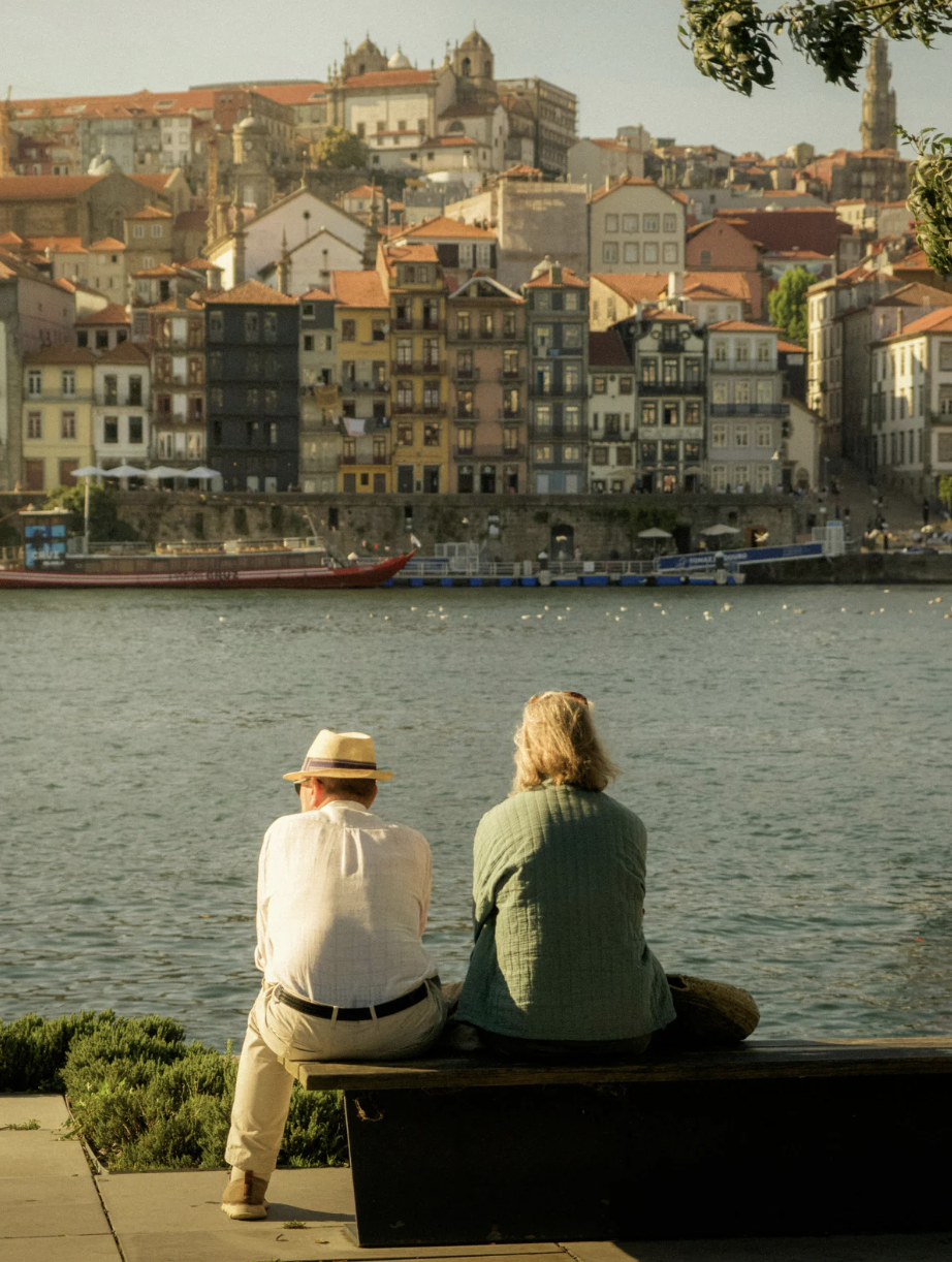 Couple sitting on the shore together
