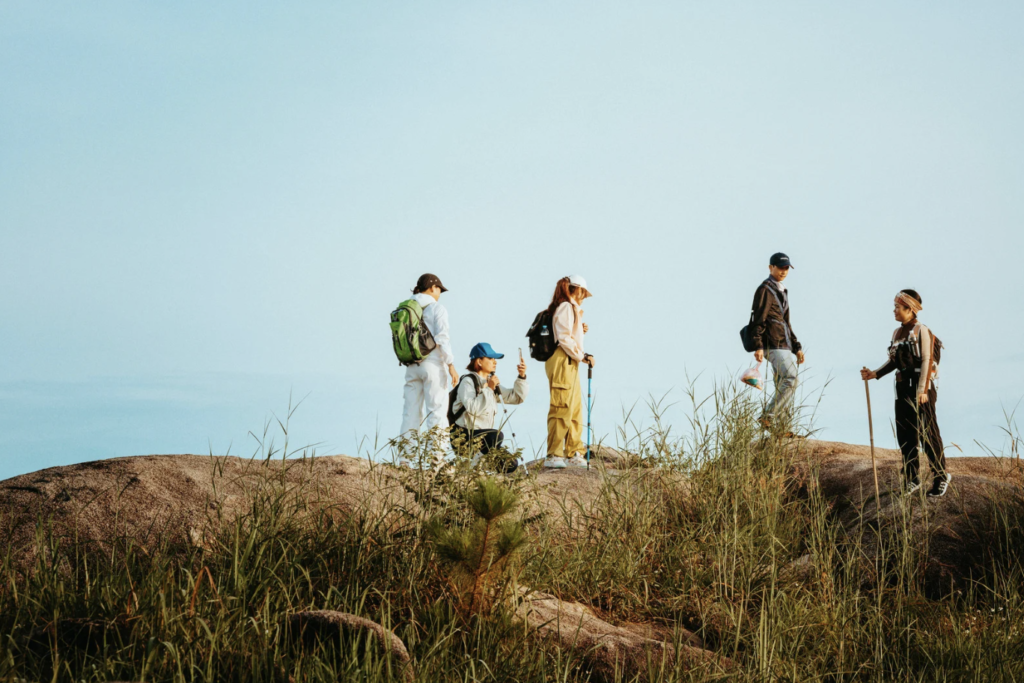 Group of adults looking at something with binoculars 